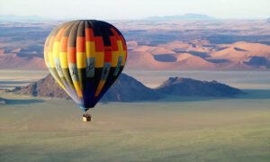 Balloon In Dramatic Landscape